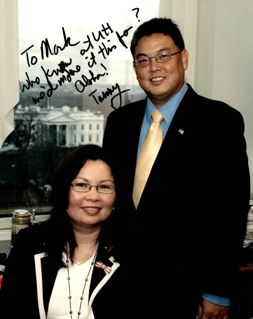 Photo of Duckworth and Takai. Inscription reads, "To Mark, Who knew at UH we'd make it this far? Aloha! Tammy"